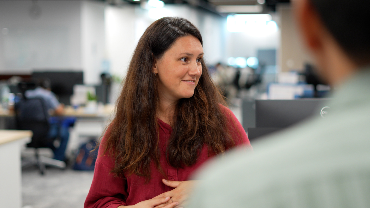 Dr Ekaterina Kochmar talks with her students in the NLP department.